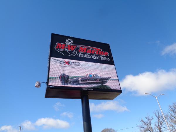 Slide: The Image of Outdoor sign for M-W Marine featuring a 2024 Ranger 1850 Reata boat. - 16