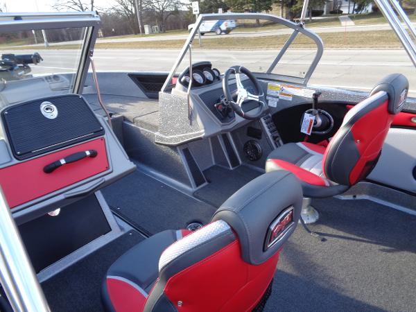 Slide: The Image of 2024 Ranger 1850 Reata boat interior with red and black seating, steering console, and dashboard. - 4