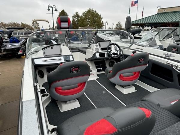 Slide: The Image of 2023 Ranger 212LS boat interior with modern dashboard and seating. - 3