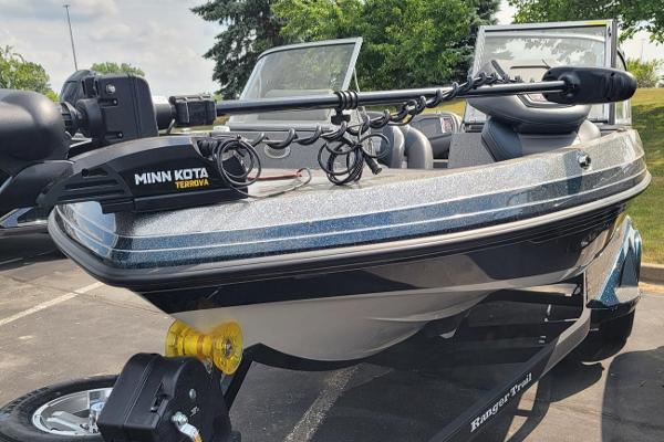 Slide: The Image of 2023 Ranger 212LS boat with Minn Kota Terrova trolling motor in parking lot. - 7