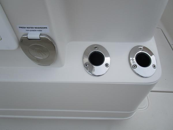 Slide: The Image of 2024 Ranger 2360 Bay boat fresh water washdown and rod holders. - 15