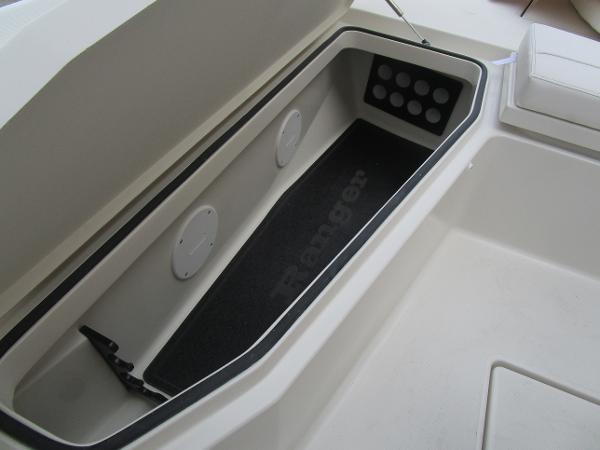 Slide: The Image of Storage compartment of 2024 Ranger 2360 Bay boat with open lid. - 30
