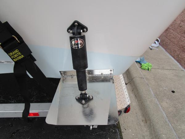 Slide: The Image of Close-up of 2024 Ranger 2360 Bay boat trim tab and shock absorber. - 37