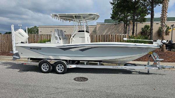Slide: The Image of 2024 Ranger 2600 Bay boat on a trailer, side view. - 10