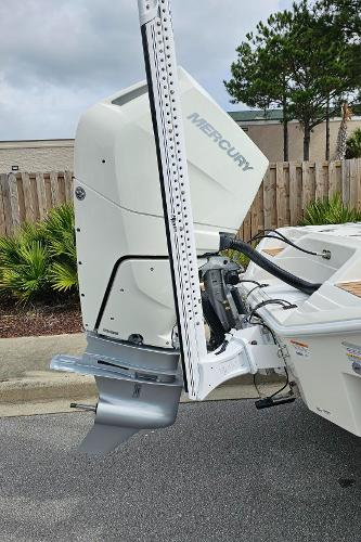 Slide: The Image of 2024 Ranger 2600 Bay boat with Mercury outboard motor. - 13