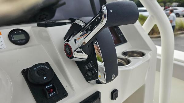 Slide: The Image of 2024 Ranger 2600 Bay boat throttle control and dashboard. - 25