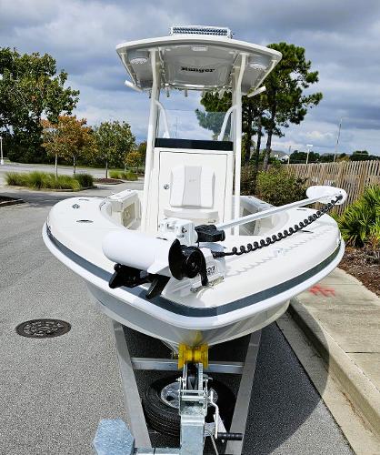 Slide: The Image of 2024 Ranger 2600 Bay boat on trailer, parked outdoors. - 3