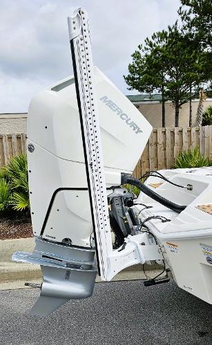 Slide: The Image of 2024 Ranger 2600 Bay boat with Mercury outboard motor. - 4
