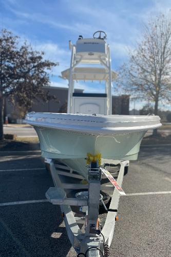 Slide: The Image of 2024 Ranger 2660 Bay boat on a trailer in a parking lot. - 5