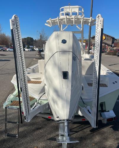 Slide: The Image of 2024 Ranger 2660 Bay boat with outboard motor and power poles. - 6