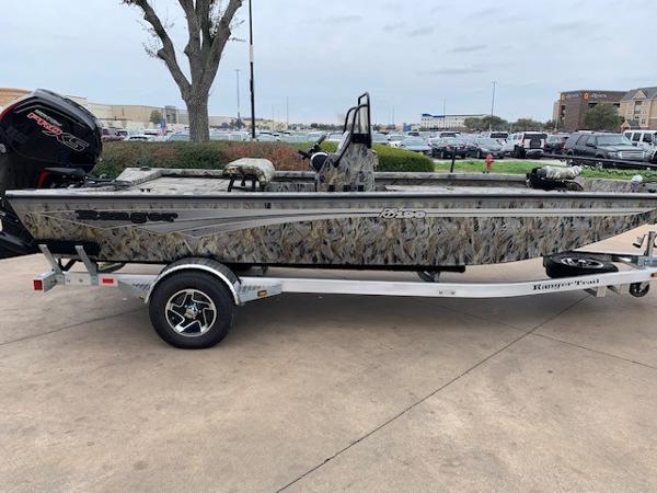 Slide: The Image of 2024 Ranger RB190 boat on trailer, camo design, parked outdoors. - 0