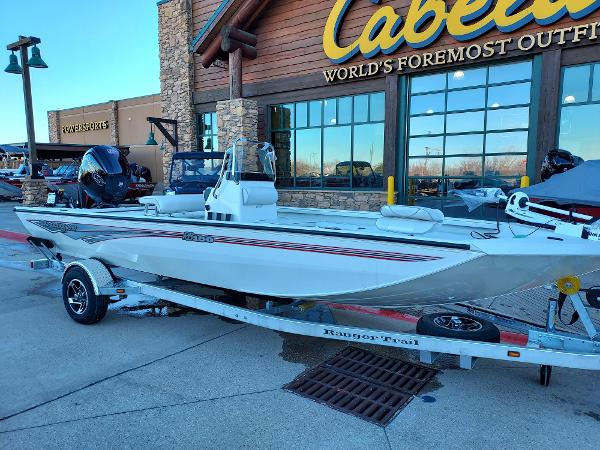 Slide: The Image of 2024 Ranger RB190 boat on trailer outside Cabela's store. - 1