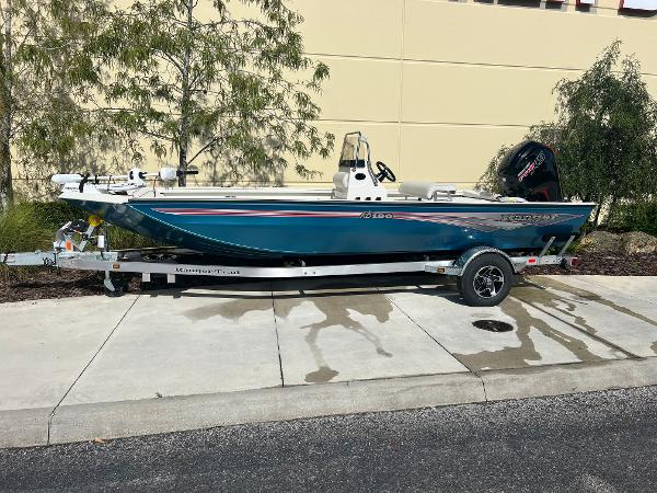 Slide: The Image of 2024 Ranger RB190 boat on a trailer, parked outdoors. - 1