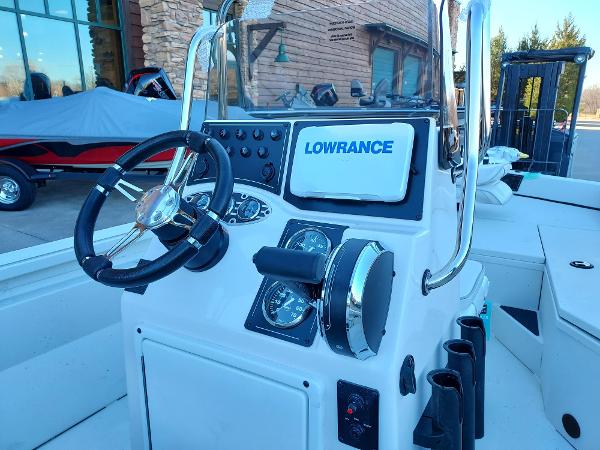 Slide: The Image of 2024 Ranger RB190 boat console with steering wheel and Lowrance electronics. - 2