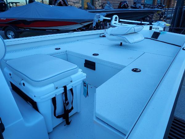 Slide: The Image of 2024 Ranger RB190 boat interior with cushioned seating and storage compartments. - 4