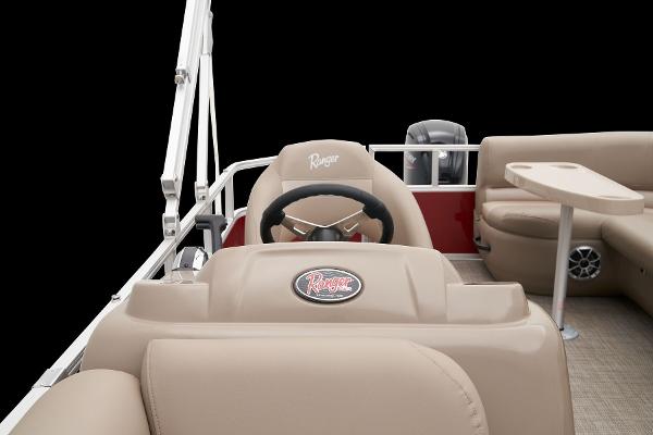 Slide: The Image of 2024 Ranger Reata 200C boat interior with beige seating and steering wheel. - 29
