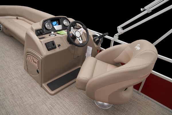 Slide: The Image of 2024 Ranger Reata 200C boat cockpit with steering wheel and captain's chair. - 30