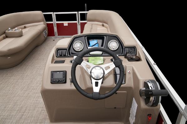 Slide: The Image of 2024 Ranger Reata 200C boat interior with steering console and seating. - 34