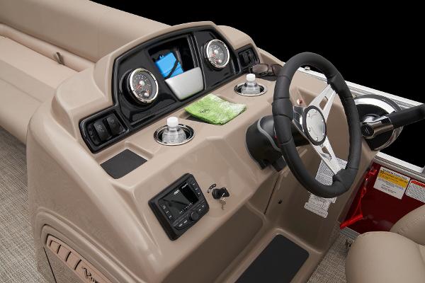 Slide: The Image of 2024 Ranger Reata 200C boat dashboard with steering wheel and instrument panel. - 35