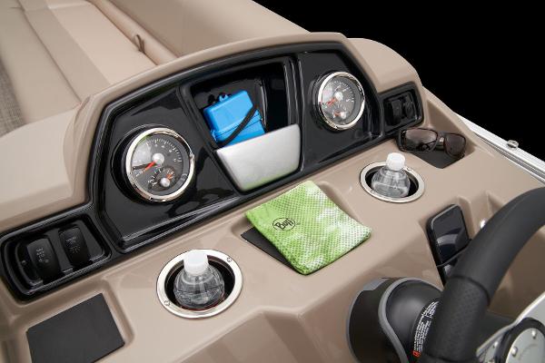 Slide: The Image of Dashboard of 2024 Ranger Reata 200C boat with gauges, cup holders, and accessories. - 36