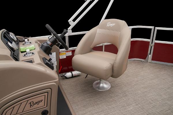 Slide: The Image of 2024 Ranger Reata 200C boat interior with captain's chair and steering console. - 40