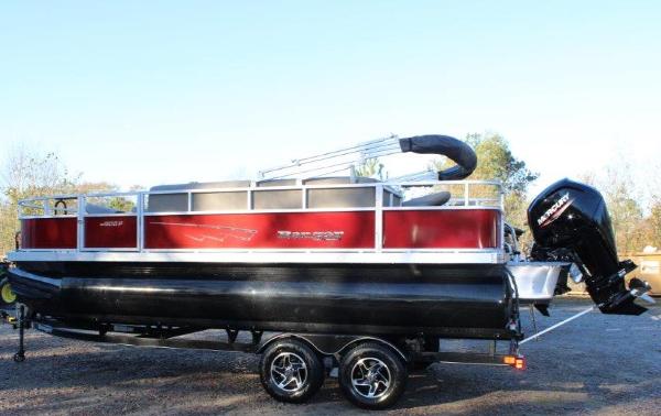Slide: The Image of 2024 Ranger Reata 200F pontoon boat on trailer, red and black color scheme. - 0
