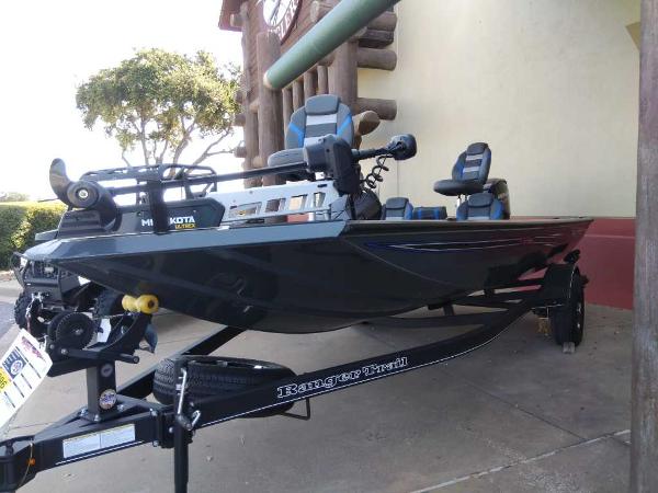Slide: The Image of 2023 Ranger RT178C fishing boat on trailer, parked outdoors. - 0