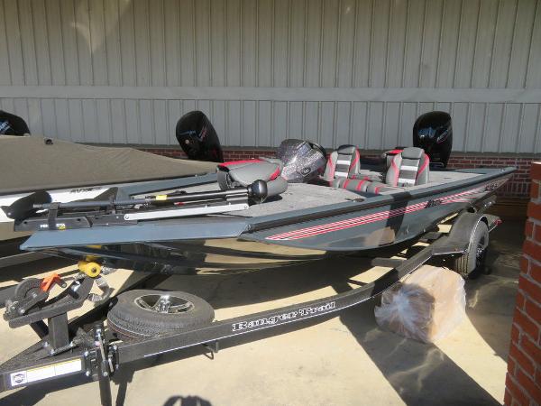 Slide: The Image of 2023 Ranger RT178C fishing boat on trailer, gray with red accents. - 1
