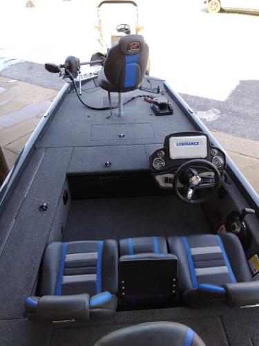 Slide: The Image of 2023 Ranger RT178C fishing boat interior with steering console and seating. - 2
