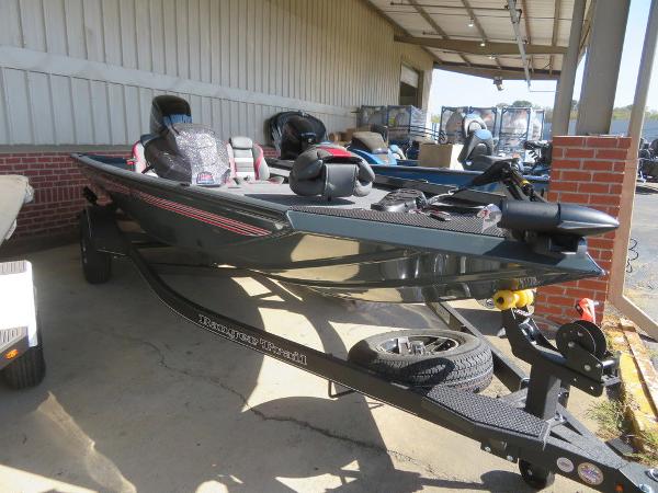 Slide: The Image of 2023 Ranger RT178C fishing boat on trailer in storage facility. - 2