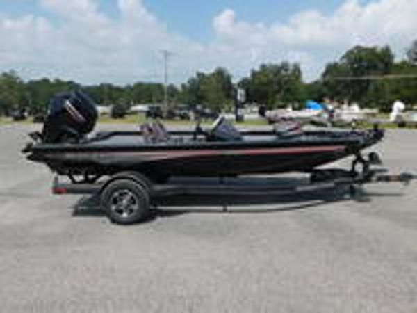 Slide: The Image of 2024 Ranger RT178C fishing boat on trailer in parking lot. - 0