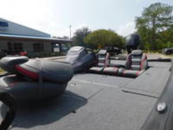Slide: The Image of 2024 Ranger RT178C fishing boat with seating and storage compartments. - 2