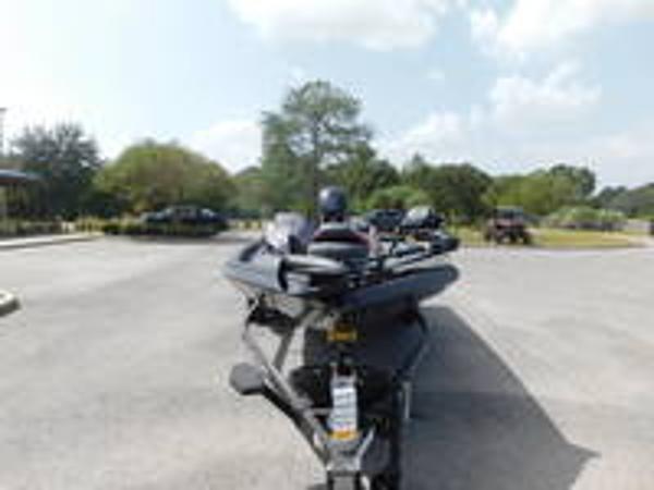 Slide: The Image of 2024 Ranger RT178C fishing boat in a parking lot. - 3