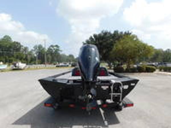 Slide: The Image of 2024 Ranger RT178C boat rear view in parking lot. - 6