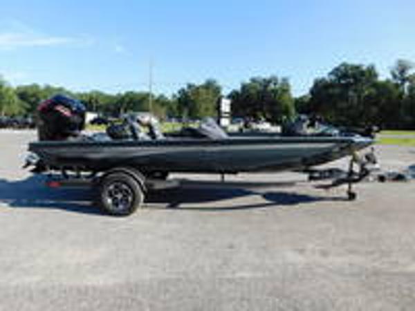 Slide: The Image of 2024 Ranger RT188 fishing boat on a trailer in a parking lot. - 1