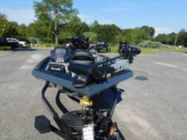 Slide: The Image of 2024 Ranger RT188 boat parked on a sunny day in a lot. - 12