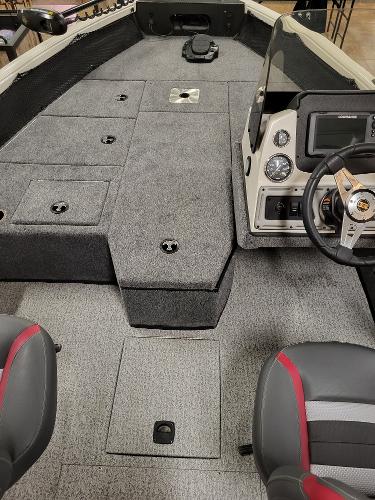 Slide: The Image of 2023 Ranger VS1682SC Angler boat interior with steering console and storage compartments. - 2