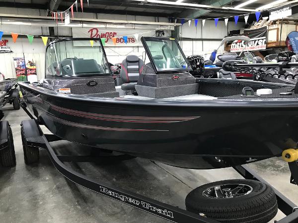 Slide: The Image of 2024 Ranger VS1782SC Angler boat displayed in showroom with trailer. - 1