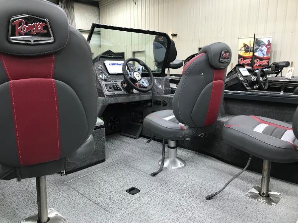 Slide: The Image of 2024 Ranger VS1782SC Angler boat interior with red and gray seating and modern dashboard. - 11
