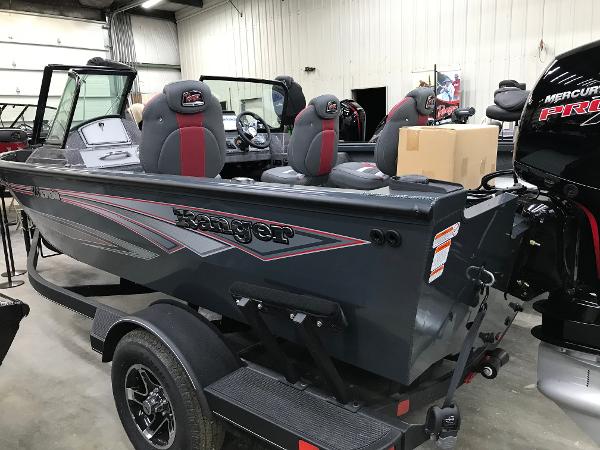 Slide: The Image of 2024 Ranger VS1782SC Angler boat with Mercury engine in a garage setting. - 3