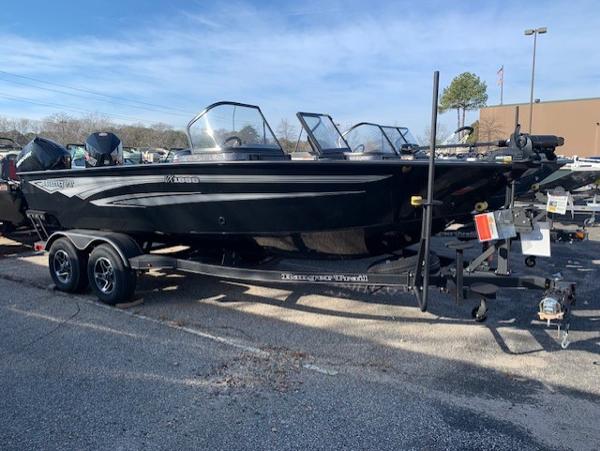 Slide: The Image of 2024 Ranger VX1888 WT black fishing boat on a trailer. - 0
