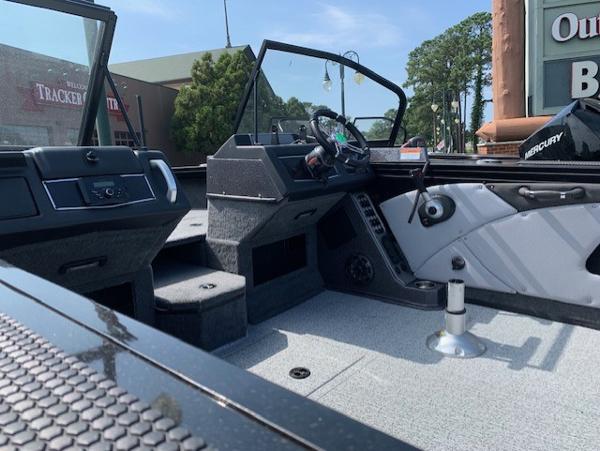 Slide: The Image of 2024 Ranger VX1888 WT boat interior with steering console and seating. - 13