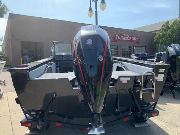 Slide: The Image of 2024 Ranger VX1888 WT boat displayed at Tracker Country dealership. - 18