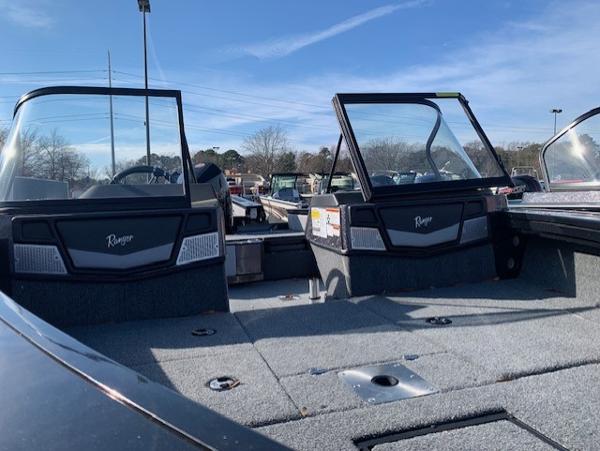 Slide: The Image of 2024 Ranger VX1888 WT boat with open windshield, spacious deck, and clear blue sky. - 3