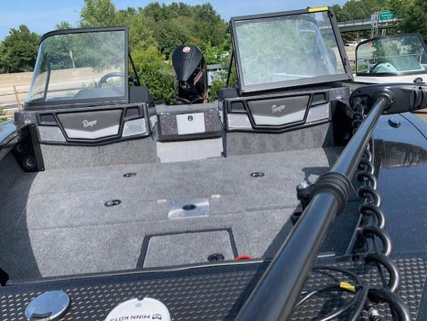 Slide: The Image of 2024 Ranger VX1888 WT fishing boat interior with dual consoles and motor. - 9