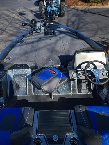Slide: The Image of 2024 Ranger Z519 boat interior with steering wheel and seating. - 4