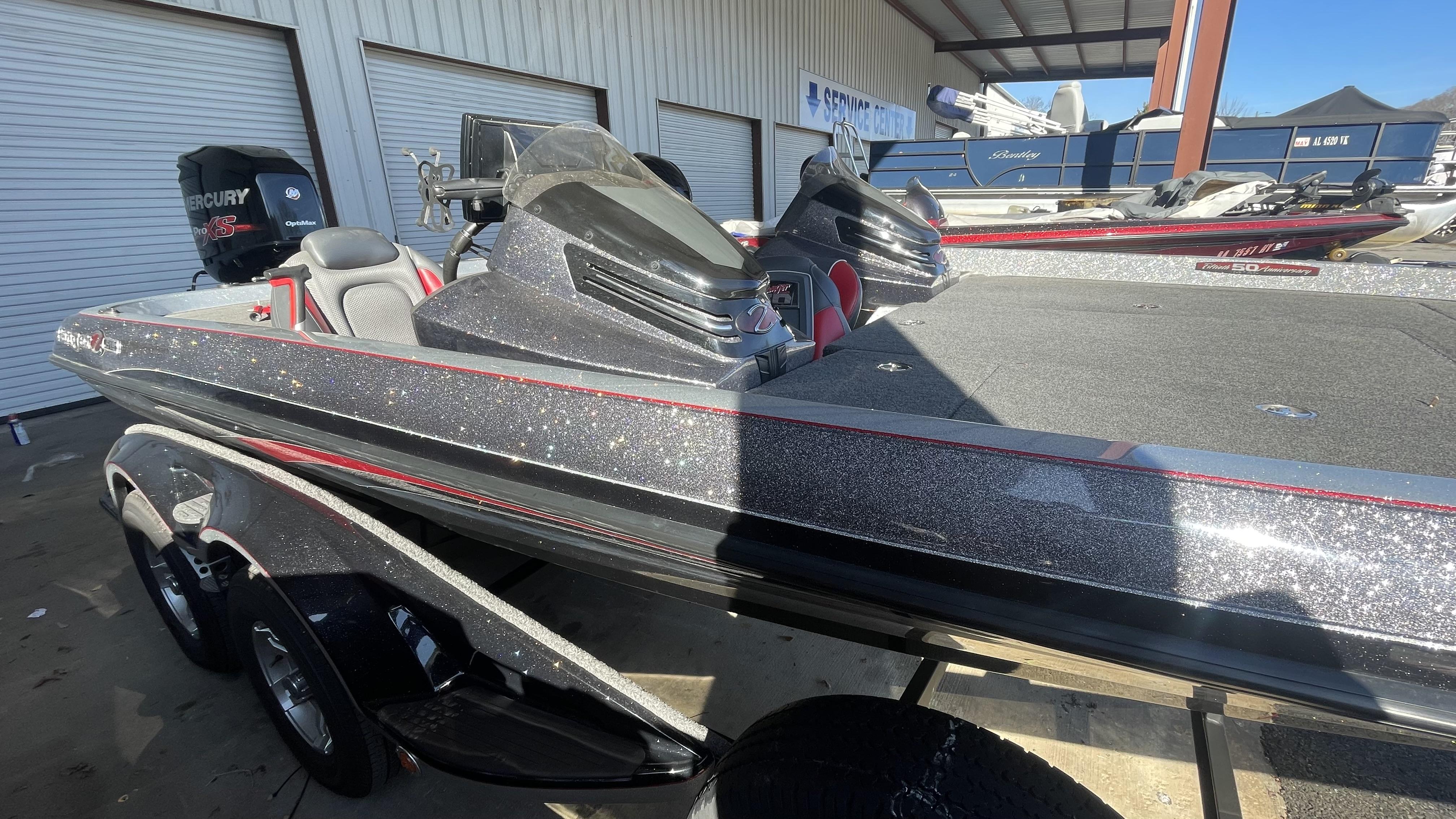 Slide: The Image of 2018 Ranger Z519C bass boat with Mercury Pro XS engine at service center. - 1