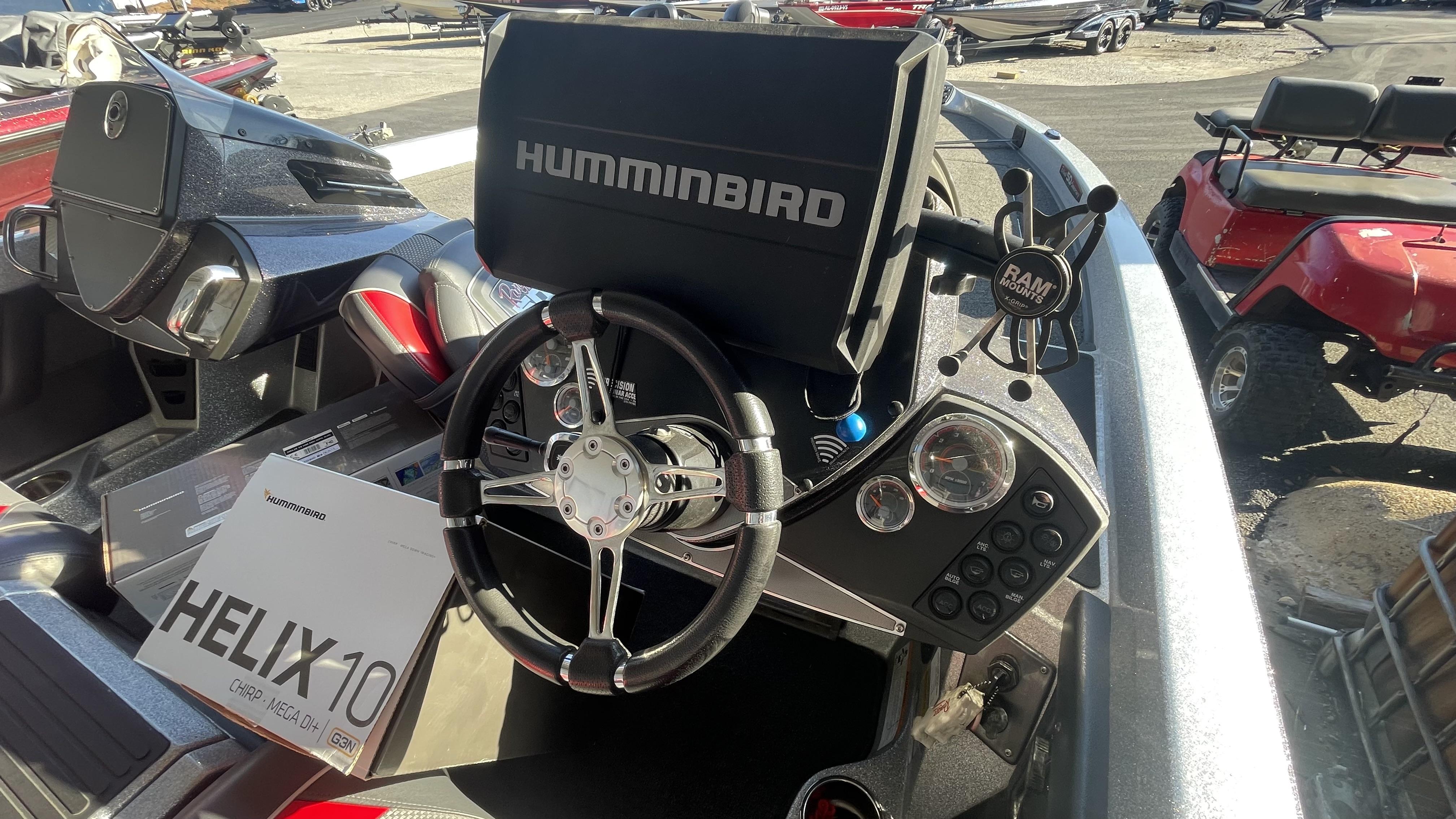 Slide: The Image of 2018 Ranger Z519C boat dashboard with Humminbird Helix 10 fish finder and steering wheel. - 10