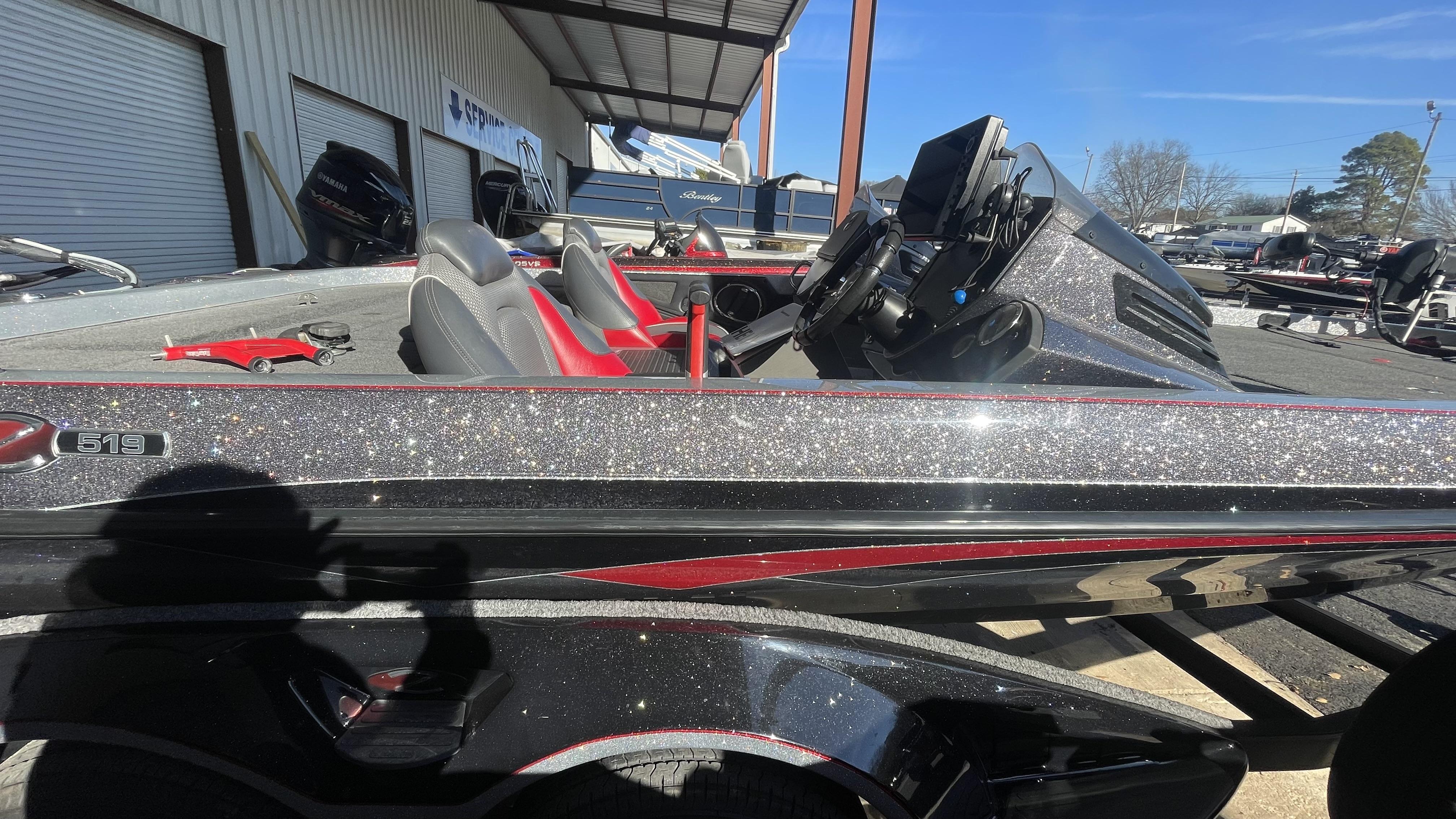 Slide: The Image of 2018 Ranger Z519C bass boat with glitter finish and Yamaha outboard motor. - 2