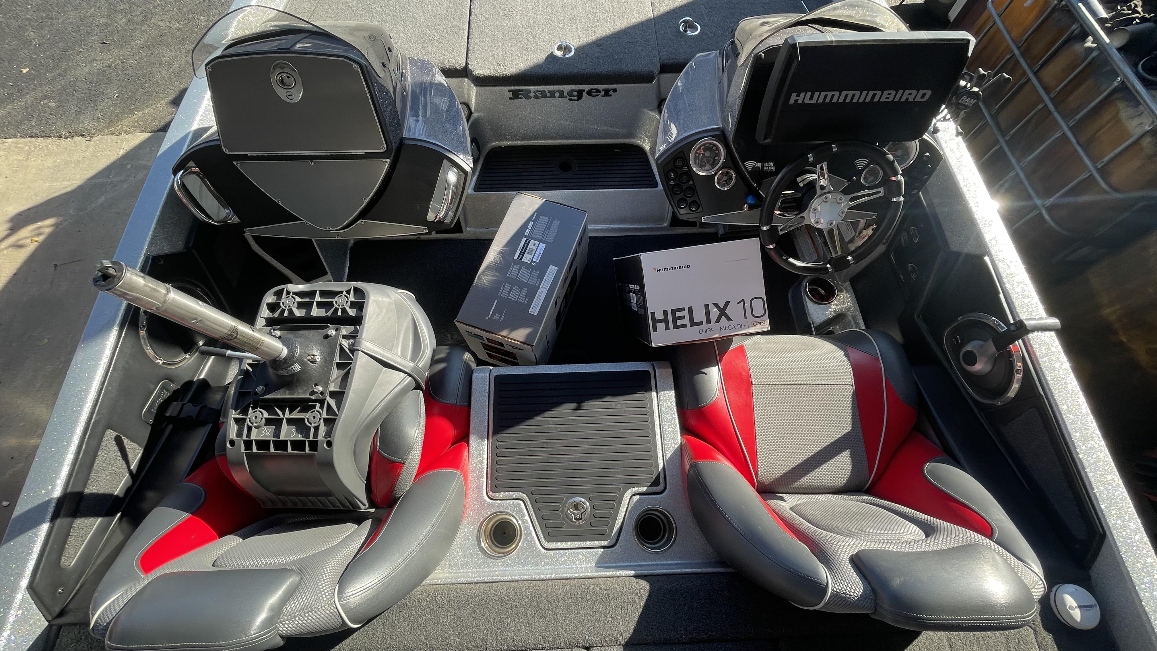 Slide: The Image of 2018 Ranger Z519C boat interior with Humminbird Helix 10 fish finder and red-gray seats. - 22